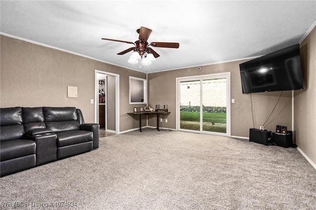 living room with crown molding, carpet, and ceiling fan