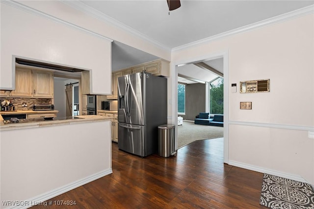 kitchen featuring ceiling fan, tasteful backsplash, dark hardwood / wood-style flooring, stainless steel fridge, and cream cabinetry