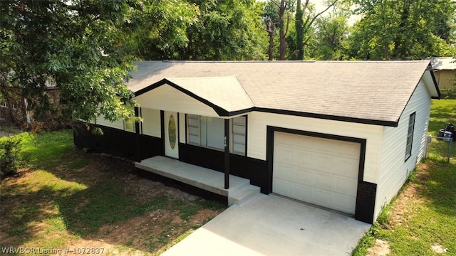 single story home with a porch and a garage