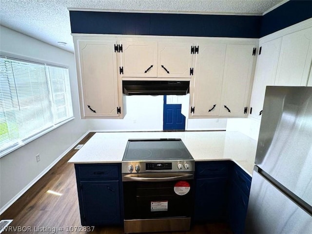 kitchen with plenty of natural light, white cabinetry, and appliances with stainless steel finishes