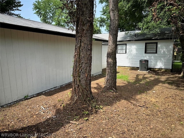 view of side of home featuring cooling unit