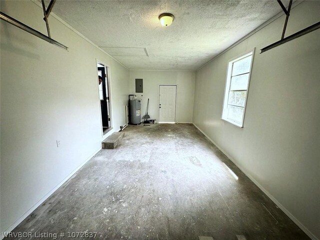 interior space with electric panel, water heater, and a textured ceiling