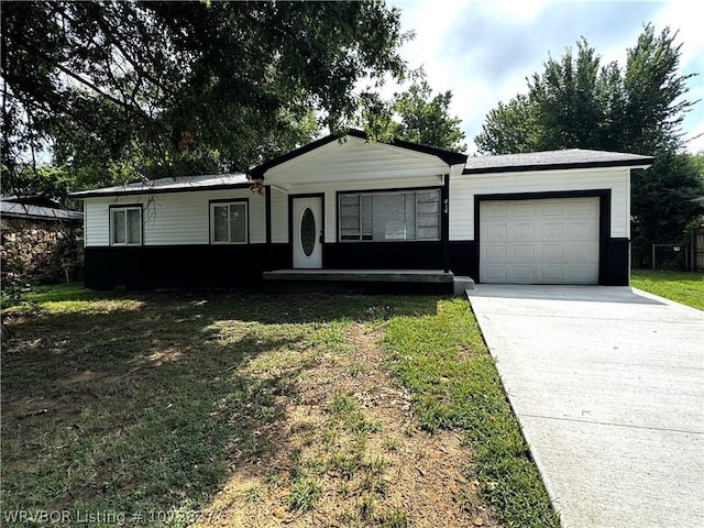 ranch-style house with a front lawn and a garage