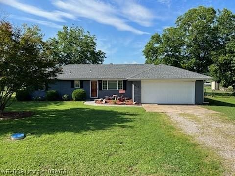 415 Francis Ln, Charleston, AR 72933 - ranch-style house featuring driveway, a garage, and a front yard