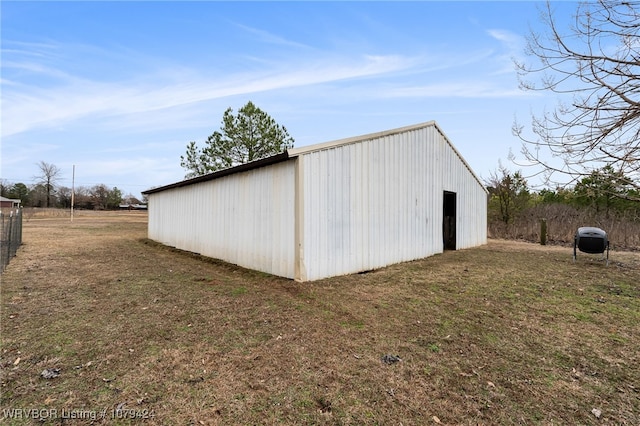 view of pole building with a yard