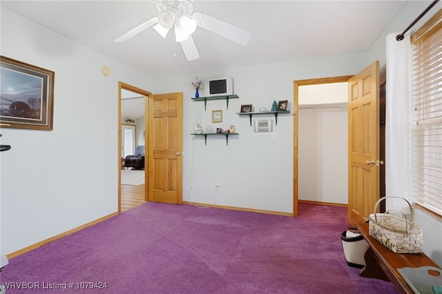 carpeted bedroom with ceiling fan and baseboards