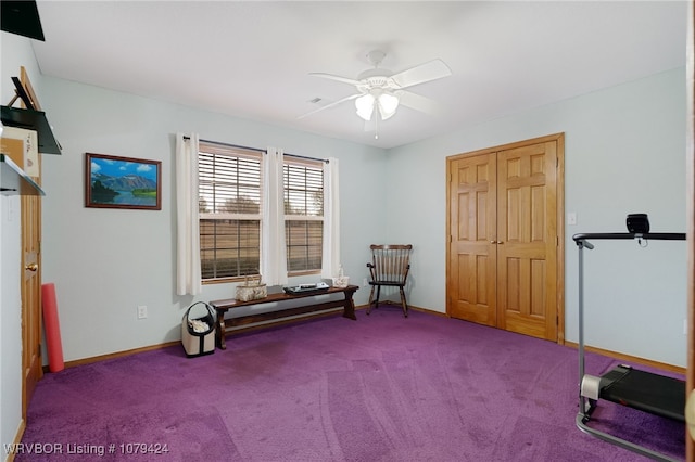 interior space featuring carpet flooring, a ceiling fan, and baseboards