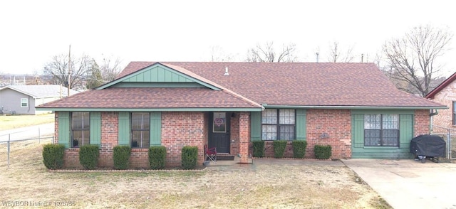 300 W Dutch Ave, Sallisaw, OK 74955 - view of front of house featuring brick siding and roof with shingles