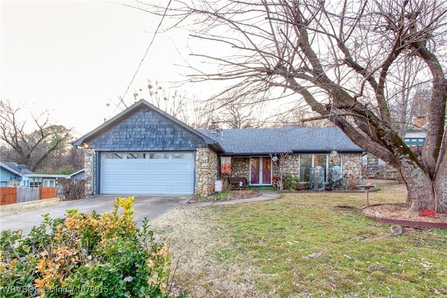 ranch-style house with a garage and a front lawn