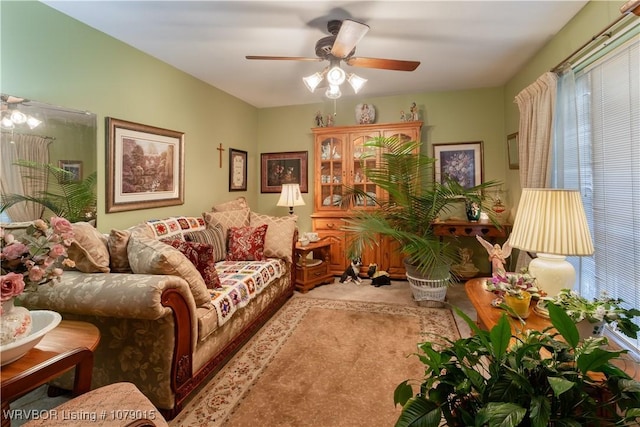 living room with carpet and ceiling fan