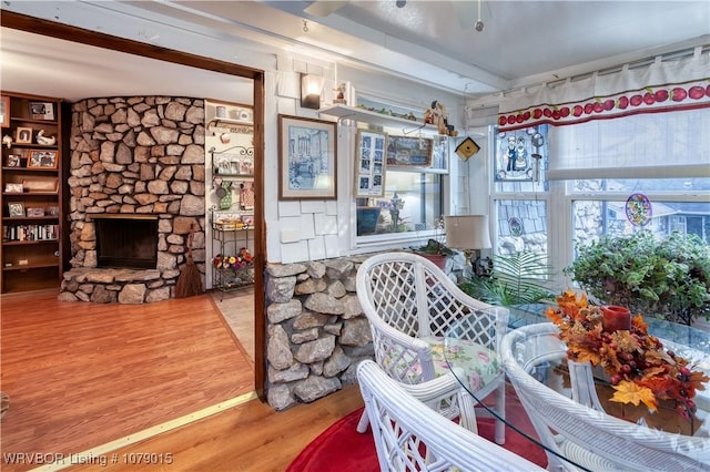 living room featuring a fireplace and wood-type flooring