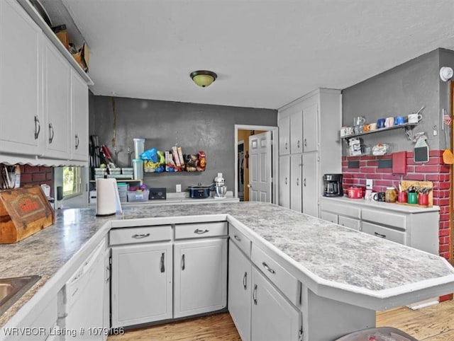 23805 270th Hwy, Howe, OK 74940 - kitchen featuring light countertops, white cabinetry, and a peninsula