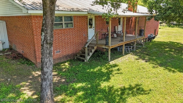 23805 270th Hwy, Howe, OK 74940 - rear view of property featuring a yard, brick siding, crawl space, and metal roof