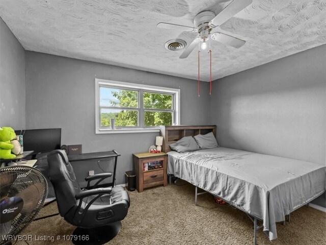 23805 270th Hwy, Howe, OK 74940 - carpeted bedroom with a textured ceiling, an office area, and ceiling fan