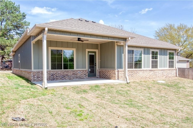 407 W Beech St, Greenwood, AR 72936 - back of property with a ceiling fan, brick siding, board and batten siding, and a patio area