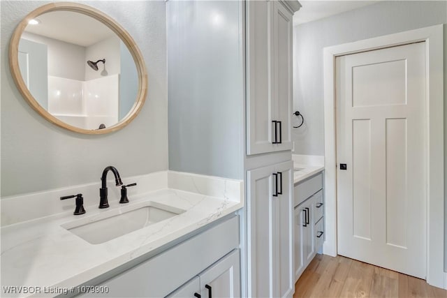 407 W Beech St, Greenwood, AR 72936 - bathroom with vanity and wood finished floors