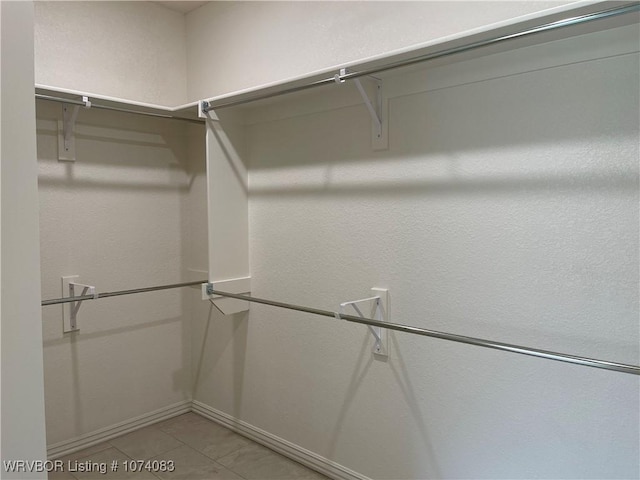 9114 Maysview Ln, Fort Smith, AR 72916 - walk in closet featuring light tile patterned floors