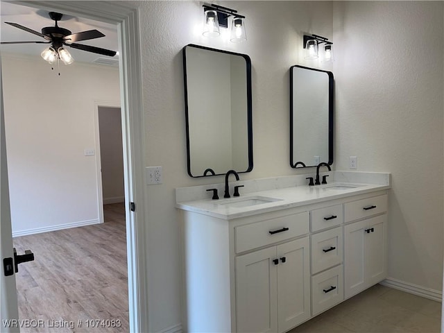 9114 Maysview Ln, Fort Smith, AR 72916 - full bathroom featuring baseboards, double vanity, ceiling fan, and wood finished floors