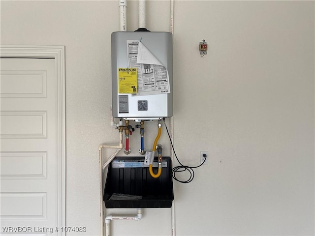 9114 Maysview Ln, Fort Smith, AR 72916 - utility room featuring tankless water heater