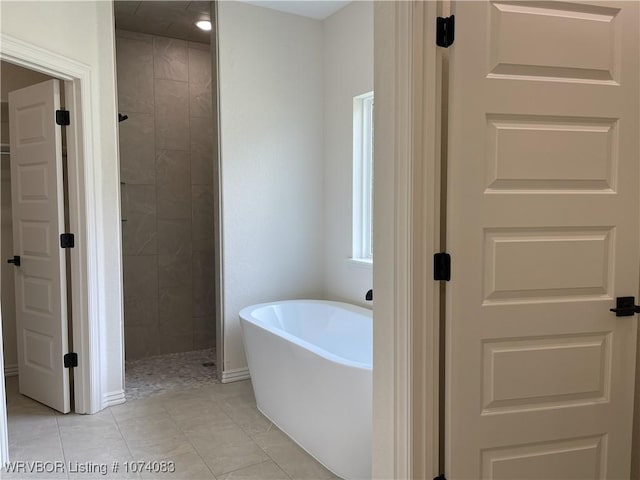 9114 Maysview Ln, Fort Smith, AR 72916 - full bathroom with a freestanding bath, a tile shower, and tile patterned flooring