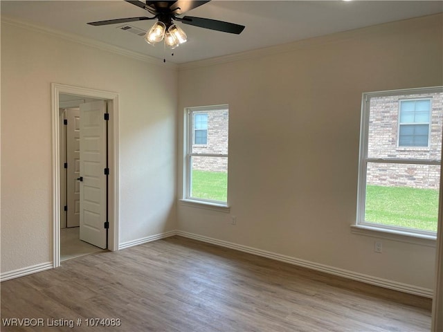 9114 Maysview Ln, Fort Smith, AR 72916 - unfurnished room with wood finished floors, crown molding, ceiling fan, and baseboards