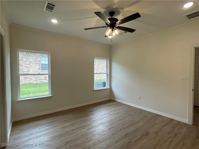 9114 Maysview Ln, Fort Smith, AR 72916 - spare room featuring ornamental molding, healthy amount of natural light, wood finished floors, baseboards, and ceiling fan