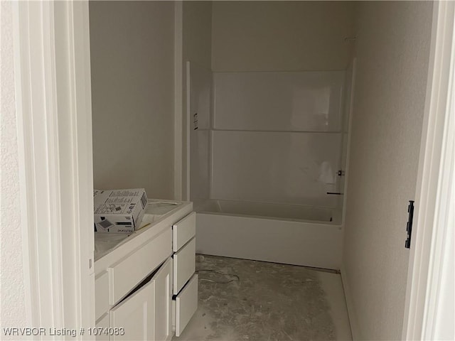 bathroom with vanity and concrete floors