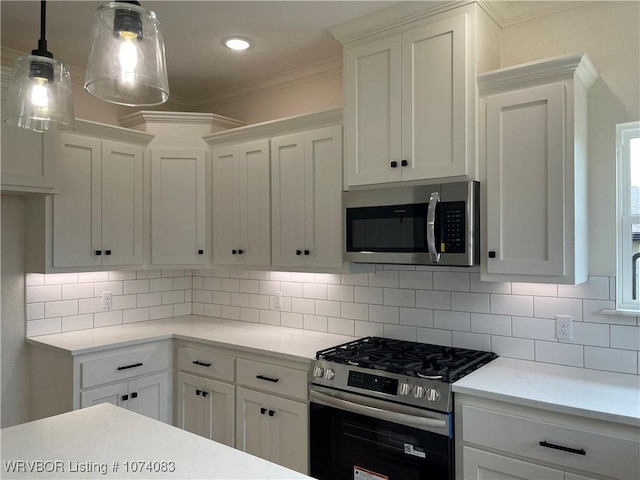 9114 Maysview Ln, Fort Smith, AR 72916 - kitchen featuring appliances with stainless steel finishes, white cabinets, ornamental molding, decorative backsplash, and hanging light fixtures