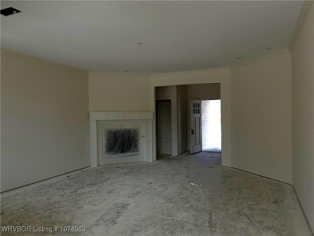 unfurnished living room with ornamental molding