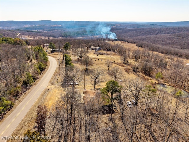 birds eye view of property with a rural view