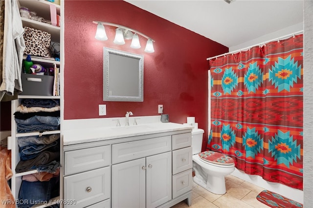 bathroom featuring a shower with shower curtain, vanity, toilet, and tile patterned flooring