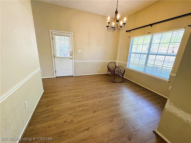 9506 Londonderry Ct, Fort Smith, AR 72908 - unfurnished room with a chandelier, plenty of natural light, and wood finished floors