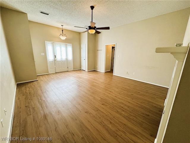 9506 Londonderry Ct, Fort Smith, AR 72908 - unfurnished room with a ceiling fan, wood finished floors, and a textured ceiling