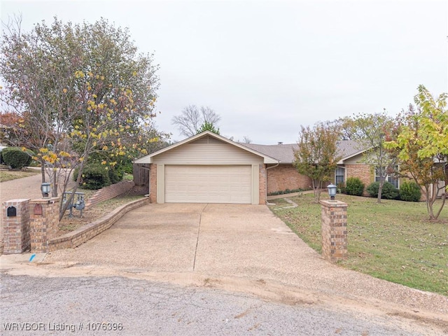 ranch-style home featuring a front yard and a garage