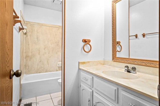 full bathroom with tile patterned flooring, vanity, bathing tub / shower combination, and toilet