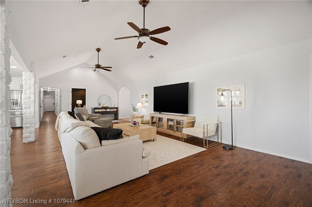21580 Ranch Rd, Howe, OK 74940 - living area featuring arched walkways, ceiling fan, wood finished floors, and high vaulted ceiling