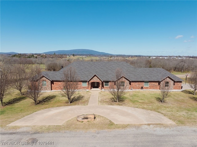 21580 Ranch Rd, Howe, OK 74940 - single story home with a front yard, brick siding, and a mountain view