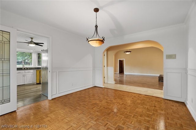 1808 Bramble Brae St, Fort Smith, AR 72908 - unfurnished room with arched walkways, wainscoting, ceiling fan, and crown molding