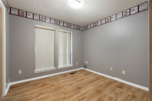 1808 Bramble Brae St, Fort Smith, AR 72908 - spare room featuring a textured ceiling and wood finished floors