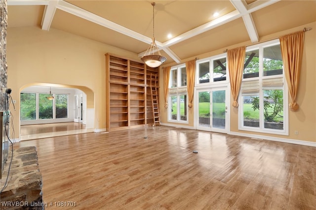 1808 Bramble Brae St, Fort Smith, AR 72908 - unfurnished living room with arched walkways, built in features, wood finished floors, and healthy amount of natural light