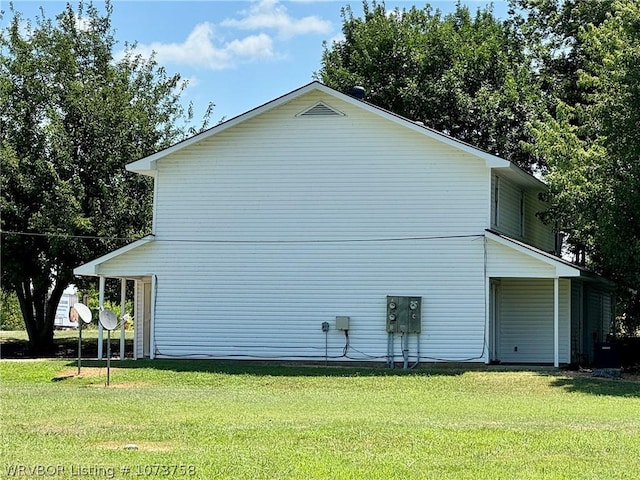 view of home's exterior with a lawn