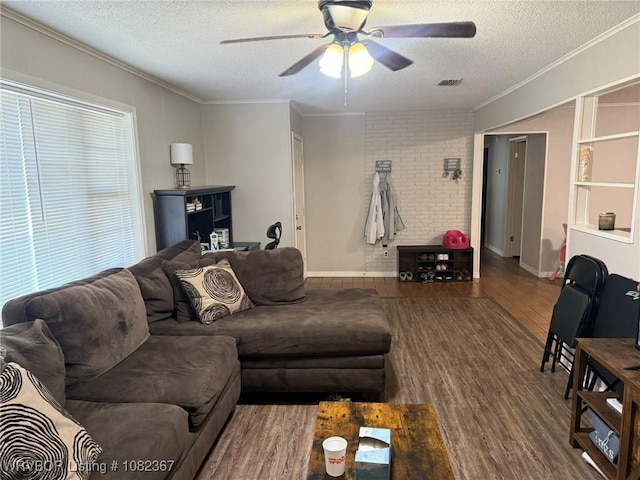 309 N 25th St, Ozark, AR 72949 - living room with a textured ceiling, crown molding, ceiling fan, and wood finished floors