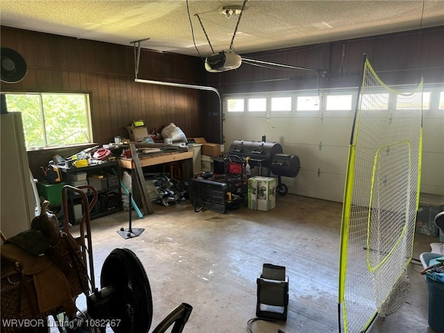 309 N 25th St, Ozark, AR 72949 - garage with a garage door opener and wood walls
