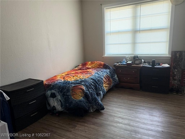 309 N 25th St, Ozark, AR 72949 - bedroom featuring multiple windows and wood finished floors