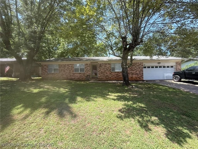 309 N 25th St, Ozark, AR 72949 - ranch-style house with an attached garage, brick siding, a front yard, and asphalt driveway