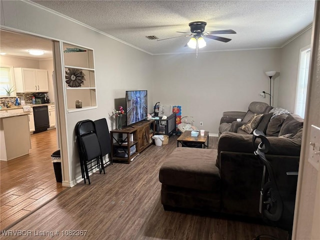 309 N 25th St, Ozark, AR 72949 - living area featuring wood finished floors, ornamental molding, a ceiling fan, and a textured ceiling