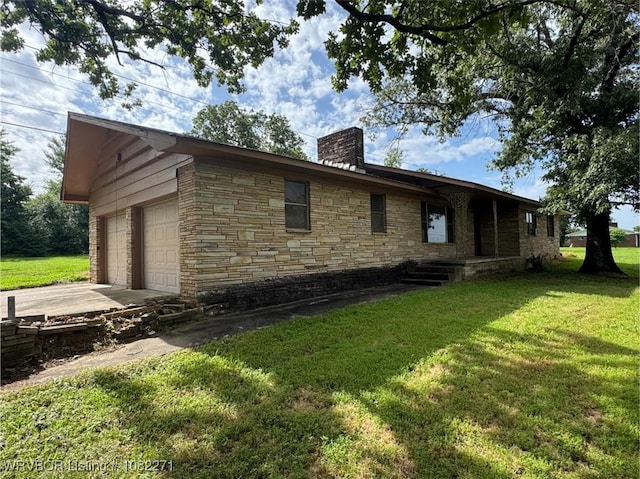 3928 N 59th Hwy, Van Buren, AR 72956 - view of side of home featuring a chimney, stone siding, a yard, a garage, and driveway