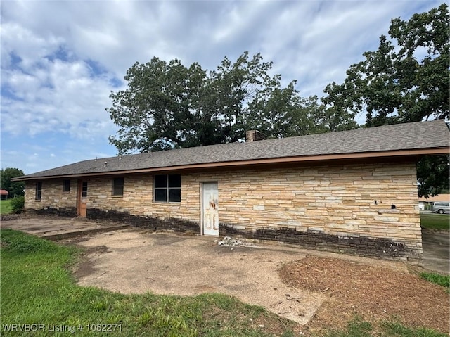 3928 N 59th Hwy, Van Buren, AR 72956 - back of house with stone siding and a chimney