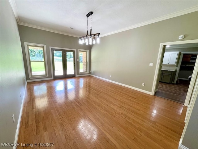 4104 Glen Flora Way, Fort Smith, AR 72908 - empty room featuring light wood-type flooring, ornamental molding, a smoke detector, and a chandelier