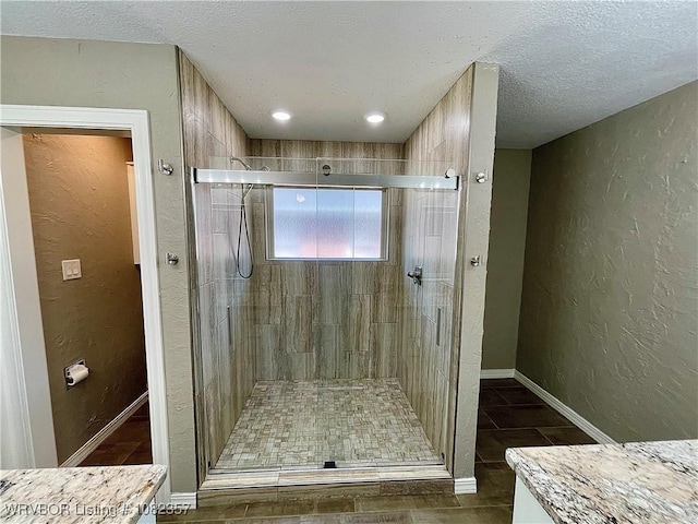 4104 Glen Flora Way, Fort Smith, AR 72908 - bathroom with a stall shower, a textured ceiling, a textured wall, and vanity